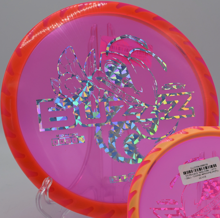 Overstable Discraft Fuzed Buzzzsaw flying over lava rock terrain at Thunderbird DGC in Show Low, Arizona, holding line in extreme wind.