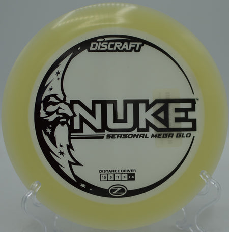 Discraft Mega Glow Seasonal Nuke blasting through the night sky on a full-power drive at Blue Ribbon Pines Disc Golf Course in East Bethel, Minnesota.