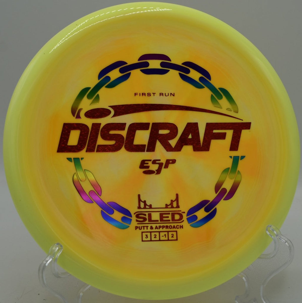 Discraft First Run ESP Sled controlled hyzer putter landing under basket at Shady Oaks Disc Golf Course in Orangevale, California