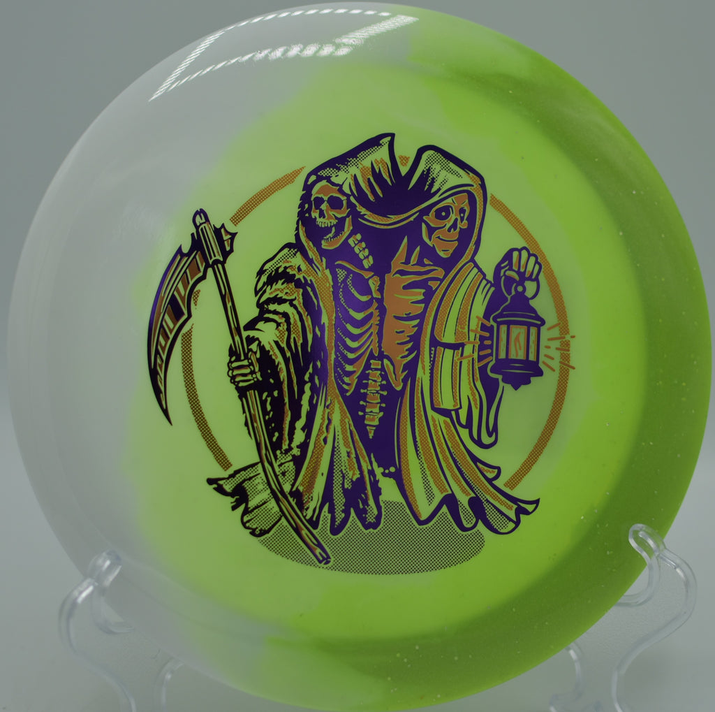 Innova Duo Wraith with split Star and Moondust Champion plastics resting on the tee at Rogers Lakewood DGC in Valparaiso, IN, highlighting its 11-speed distance potential.