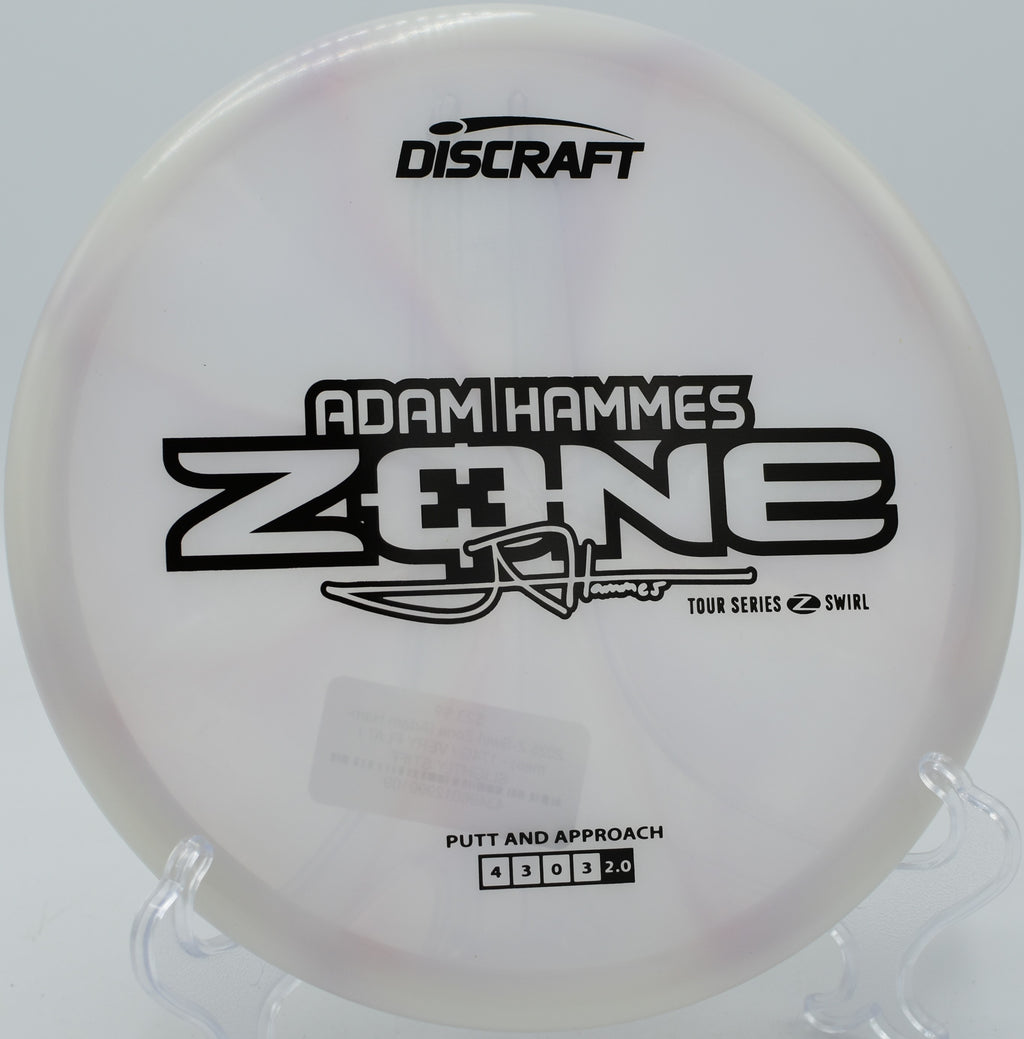 Z Swirl Zone photographed mid-flight over the basket at Harmon Hills Disc Golf Course in Fall Branch, Tennessee.

