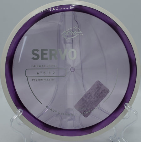 Proton Servo fairway driver carving a tight tunnel shot at Hidden Lake Disc Golf Course in Burlington, North Carolina, holding neutral stability with clean forward fade