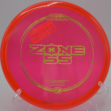 Discraft Z Zone SS approach putter flying straight at Maple Hill Disc Golf Course in Leicester, Massachusetts.