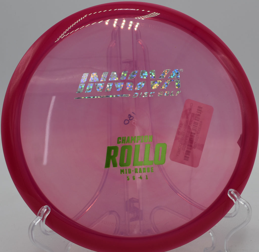 Champion Rollo midrange disc on a wooded fairway at Creekside Park Disc Golf Course in Archdale, NC