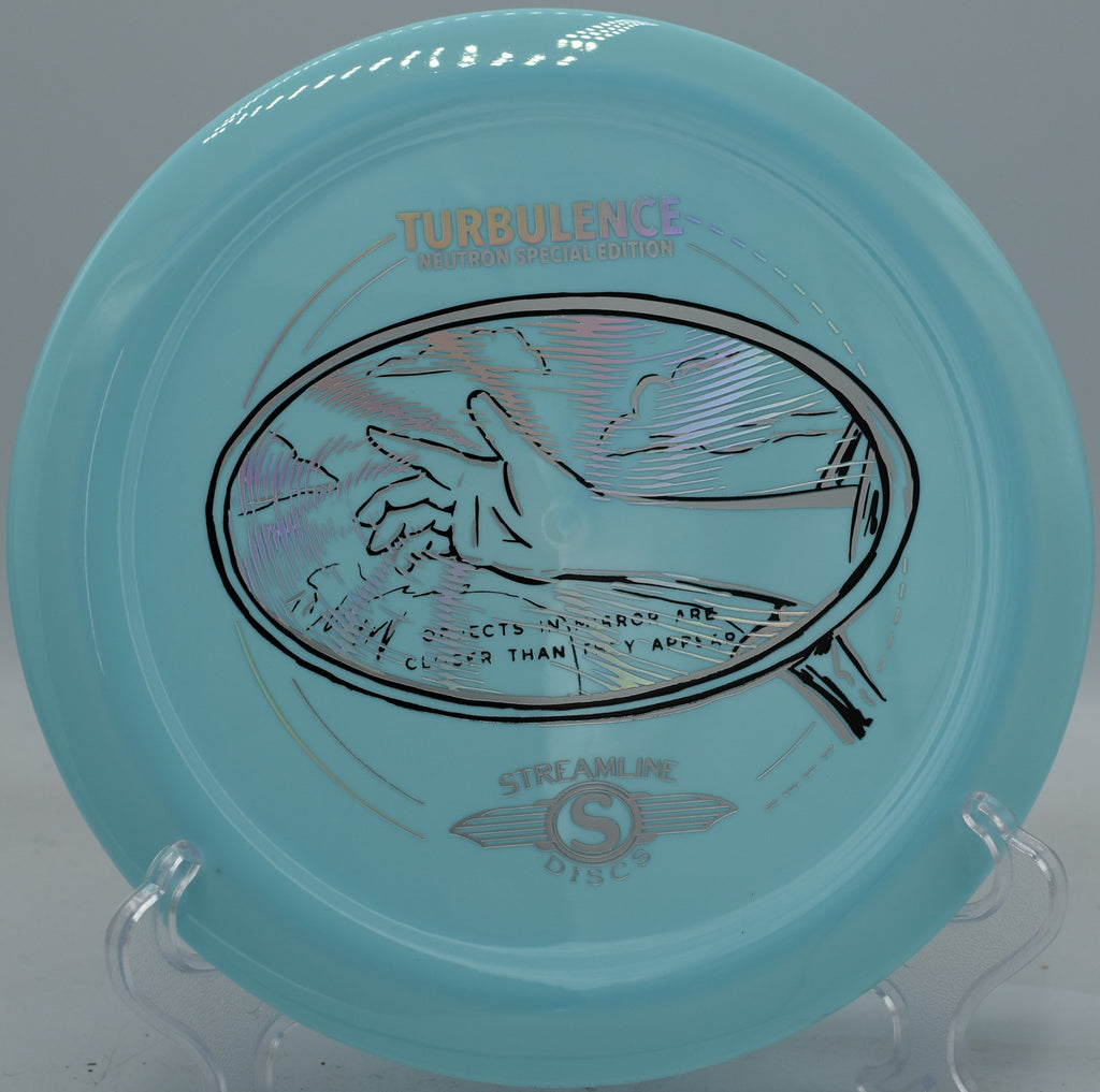 Neutron Turbulence fired on a forehand spike hyzer, landing flat with minimal skip at Maple Hill’s wooded green.

