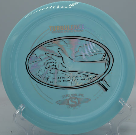 Neutron Turbulence fired on a forehand spike hyzer, landing flat with minimal skip at Maple Hill’s wooded green.

