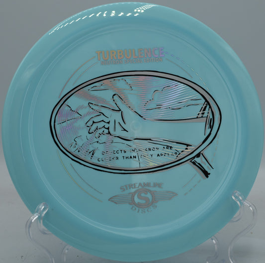 Neutron Turbulence fired on a forehand spike hyzer, landing flat with minimal skip at Maple Hill’s wooded green.

