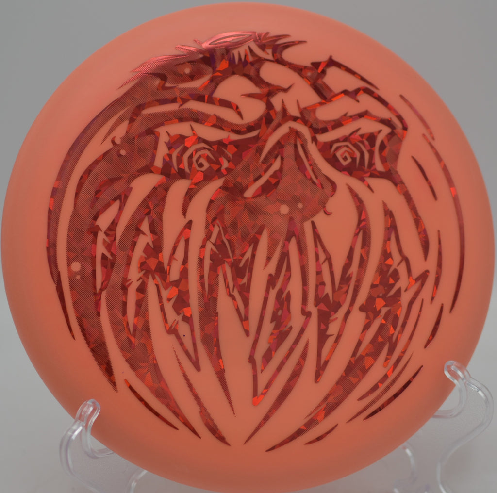 Halloween Nexus Proto Glow Aviar glowing bright on a circle one putt at Maple Hill Disc Golf Course in Leicester, Massachusetts.