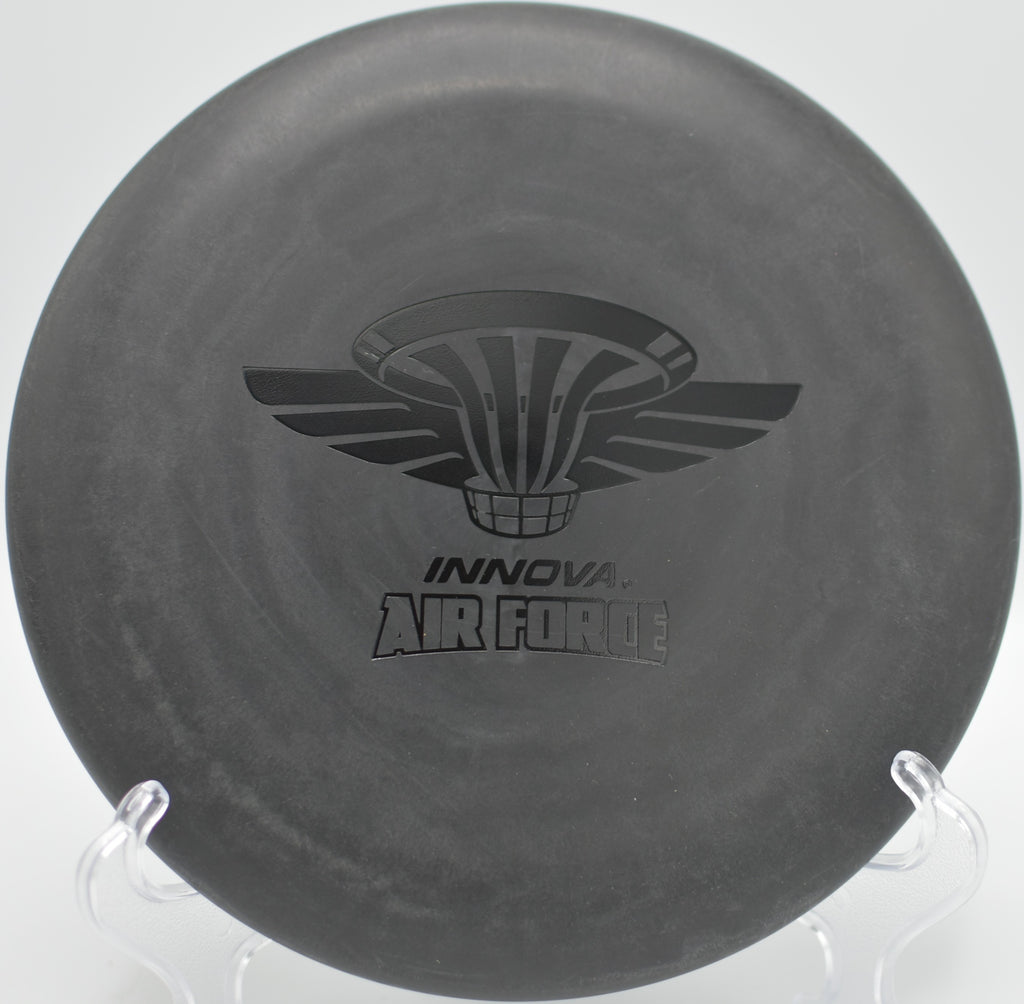 Black DX Aviar dropping cleanly into chains at Maple Hill Disc Golf Course in Leicester, Massachusetts.