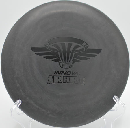 Black DX Aviar dropping cleanly into chains at Maple Hill Disc Golf Course in Leicester, Massachusetts.