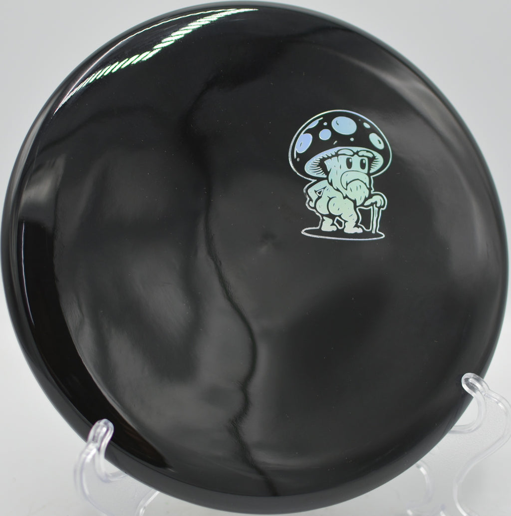 Doomsday Discs Rot Survival plastic beaded putter flying straight toward the chains at Blue Ribbon Pines Disc Golf Course in East Bethel, Minnesota.