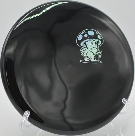 Doomsday Discs Rot Survival plastic beaded putter flying straight toward the chains at Blue Ribbon Pines Disc Golf Course in East Bethel, Minnesota.