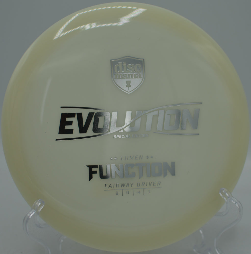 Discmania Neo Lumen Function control driver gliding smooth anhyzers at Hornets Nest Disc Golf Course in Charlotte, North Carolina.