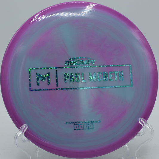 Paul McBeth Prototype Malita flying straight on a hyzer flip release at Pier Park Disc Golf Course in Portland, Oregon
