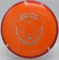 A disc golfer throwing a long, straight drive with a Fission Rhythm at Bucksnort Disc Golf Course in Pine, Colorado.