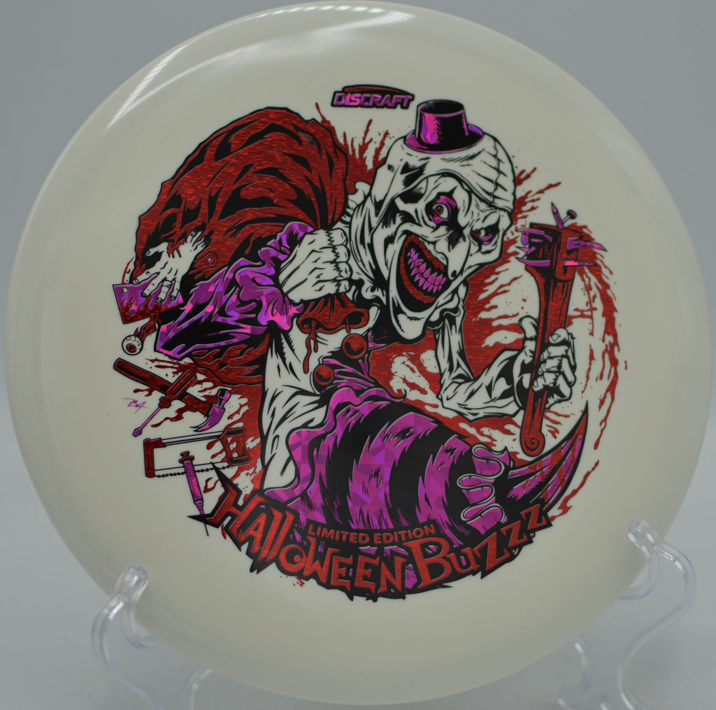 Discraft Halloween Glo Triple Stamped Buzzz 2025 edition flying straight at Harmony Bends Disc Golf Course in Columbia, Missouri.