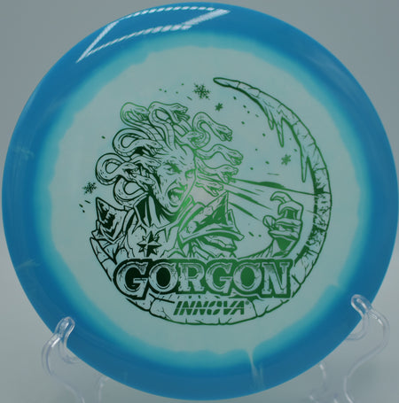 Innova Halo Star Gorgon Holiday Edition ripping a power backhand at Maple Hill DGC in Leicester, MA, gliding clean through the tunnel with neutral-stable precision.