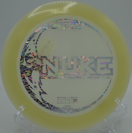 Mega Glow Nuke glowing bright during a max-distance hyzer bomb at Fountain Hills Disc Golf Course in Fountain Hills, Arizona.