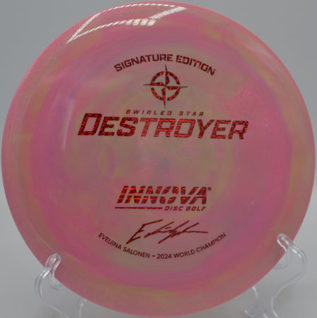 Innova Swirled Star Destroyer flying on a massive hyzer flip over the fairway at Morley Field Disc Golf Course in San Diego, California.