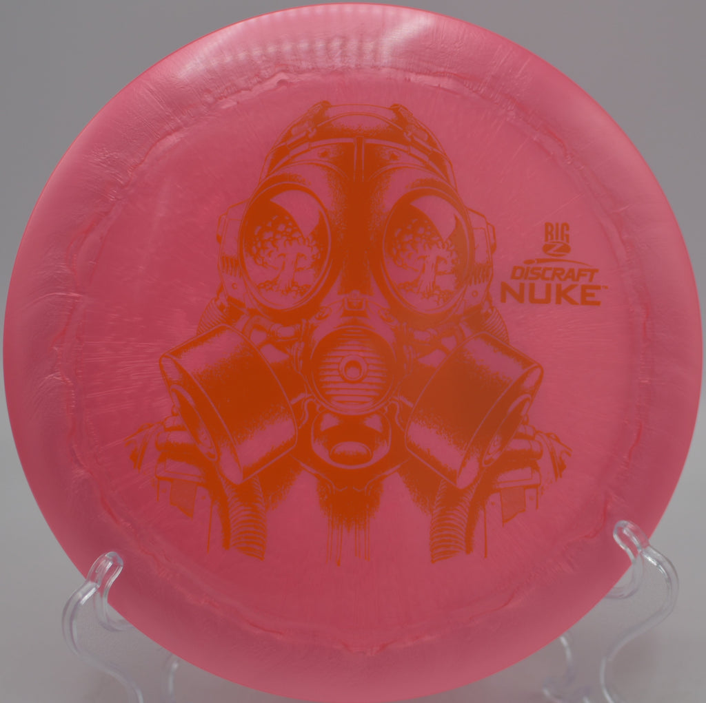 Player launching a vibrant Big Z Nuke on a high-glide distance line at Milo McIver State Park Disc Golf Course in Estacada, Oregon.