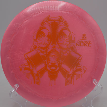 Player launching a vibrant Big Z Nuke on a high-glide distance line at Milo McIver State Park Disc Golf Course in Estacada, Oregon.