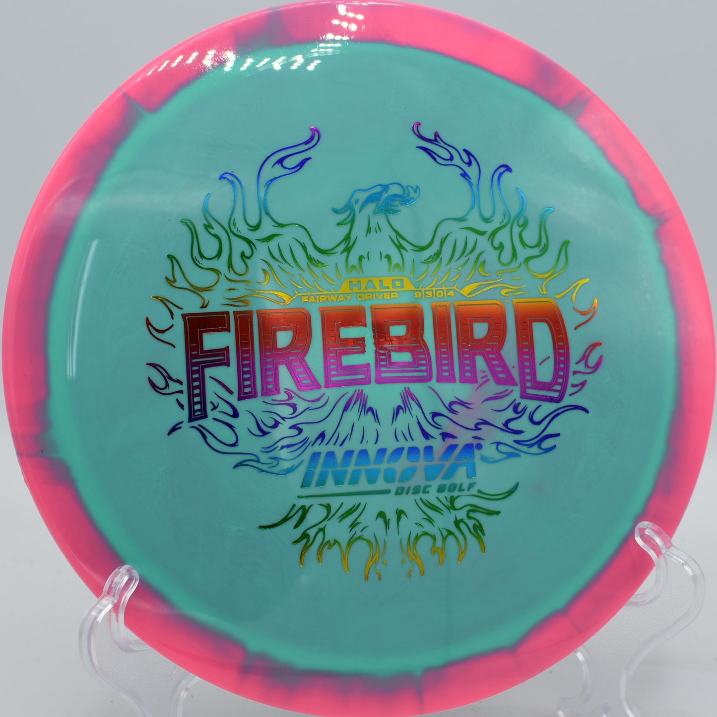 Innova Halo Firebird carving a wide spike hyzer around dense trees at Iron Hill in Delaware.

