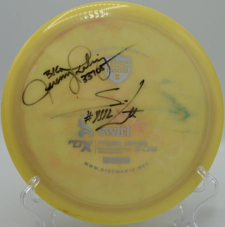 Swirly Star PDx control driver ripping through a tight fairway at Idlewild Disc Golf Course in Burlington, Kentucky, highlighting overstable flight, torque resistance, and dependable fade for controlled power disc golf drives