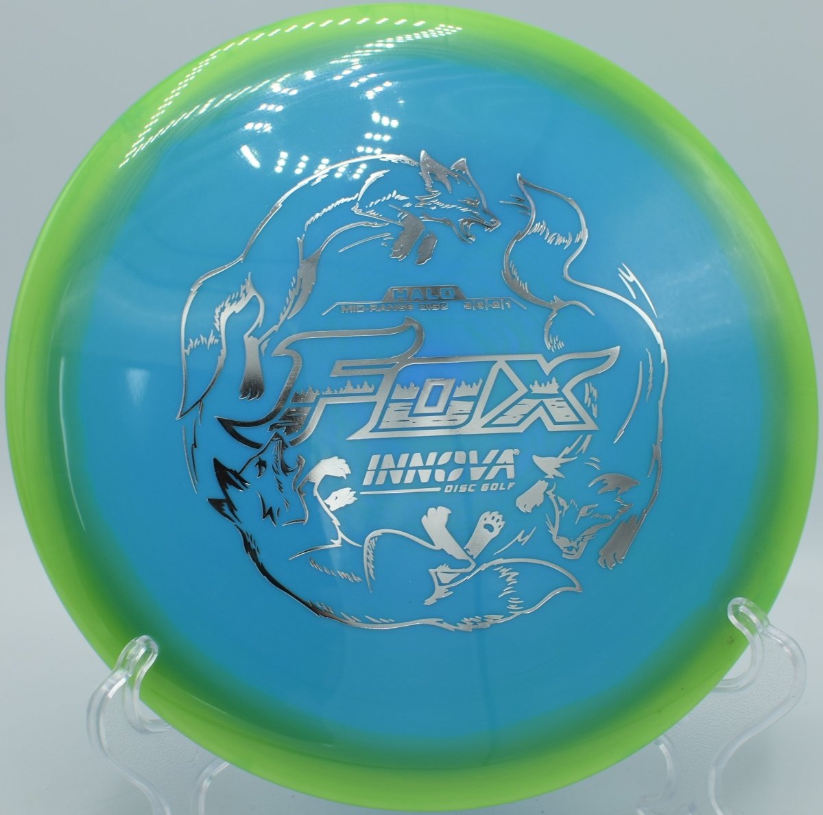 Halo Star Fox fairway driver ripping a straight control line through wooded gap at R.L. Smith Disc Golf Course in Charlotte, North Carolina