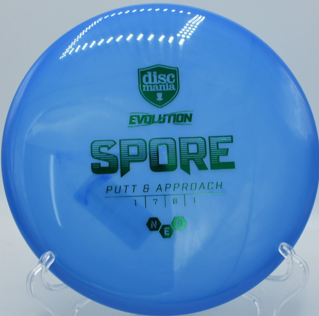 Discmania Neo Spore resting on the fairway at Idlewild Disc Golf Course in Burlington, Kentucky, delivering floaty flights and easy control