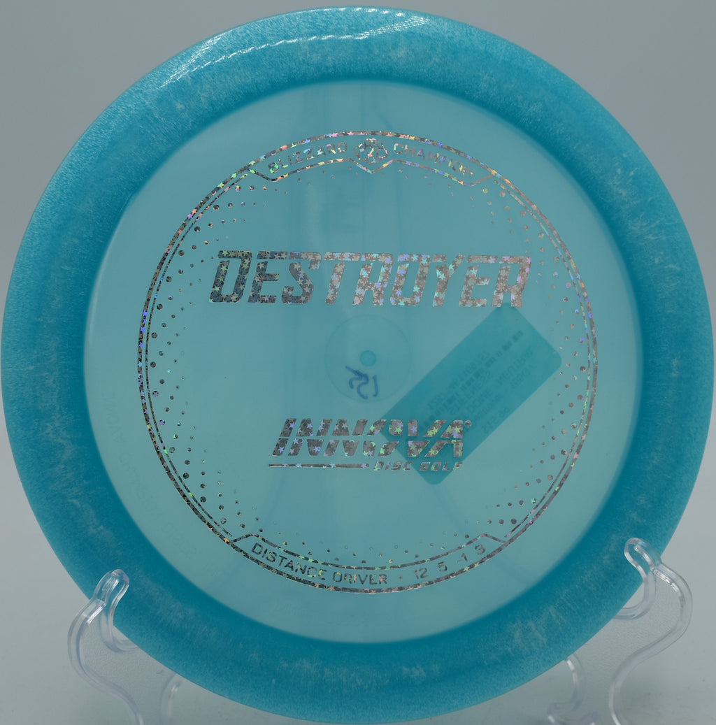 Blizzard Champion Destroyer disc flying a long hyzer-flip at DeLaveaga Disc Golf Course in Santa Cruz, California