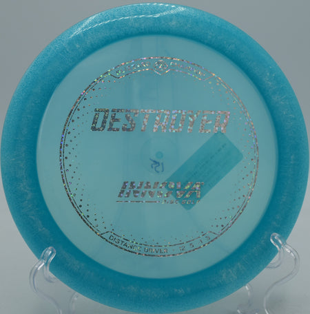 Blizzard Champion Destroyer disc flying a long hyzer-flip at DeLaveaga Disc Golf Course in Santa Cruz, California