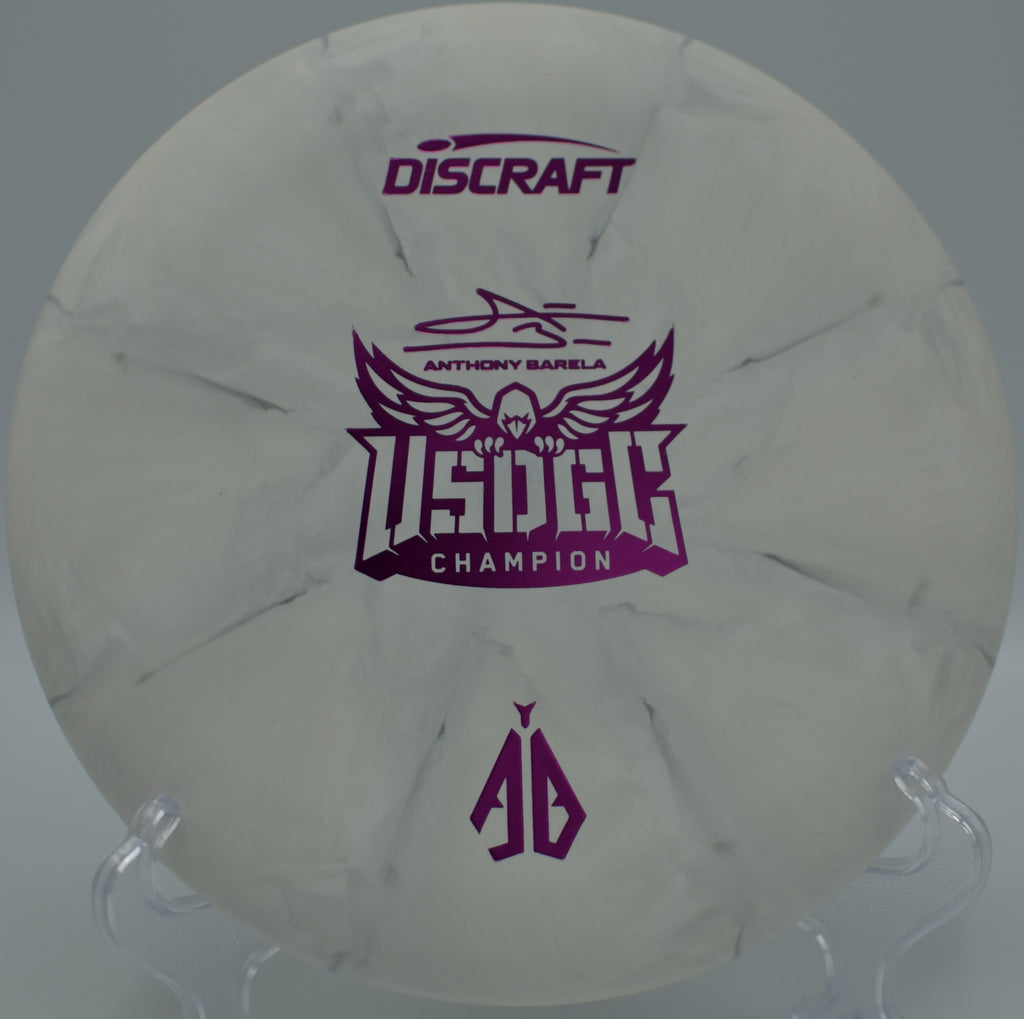 CT Swirl Focus photographed near the basket at Lincoln Park DGC in Minot, ND, highlighting its straight-to-fade putting control.