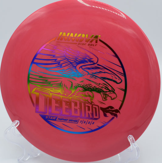 An Innova Star Teebird carving a tight fairway line at Hillcrest Farm Disc Golf Course in Prince Edward Island, Canada.