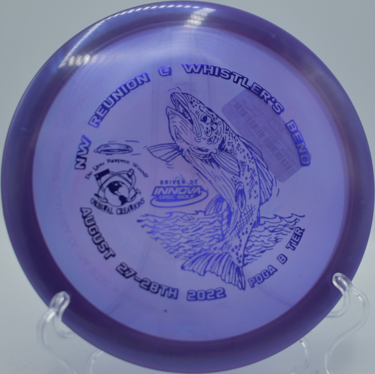 Innova Champion Leopard driver holding a straight glide line with minimal fade at Hickory Hills Disc Golf Course in Traverse City, Michigan