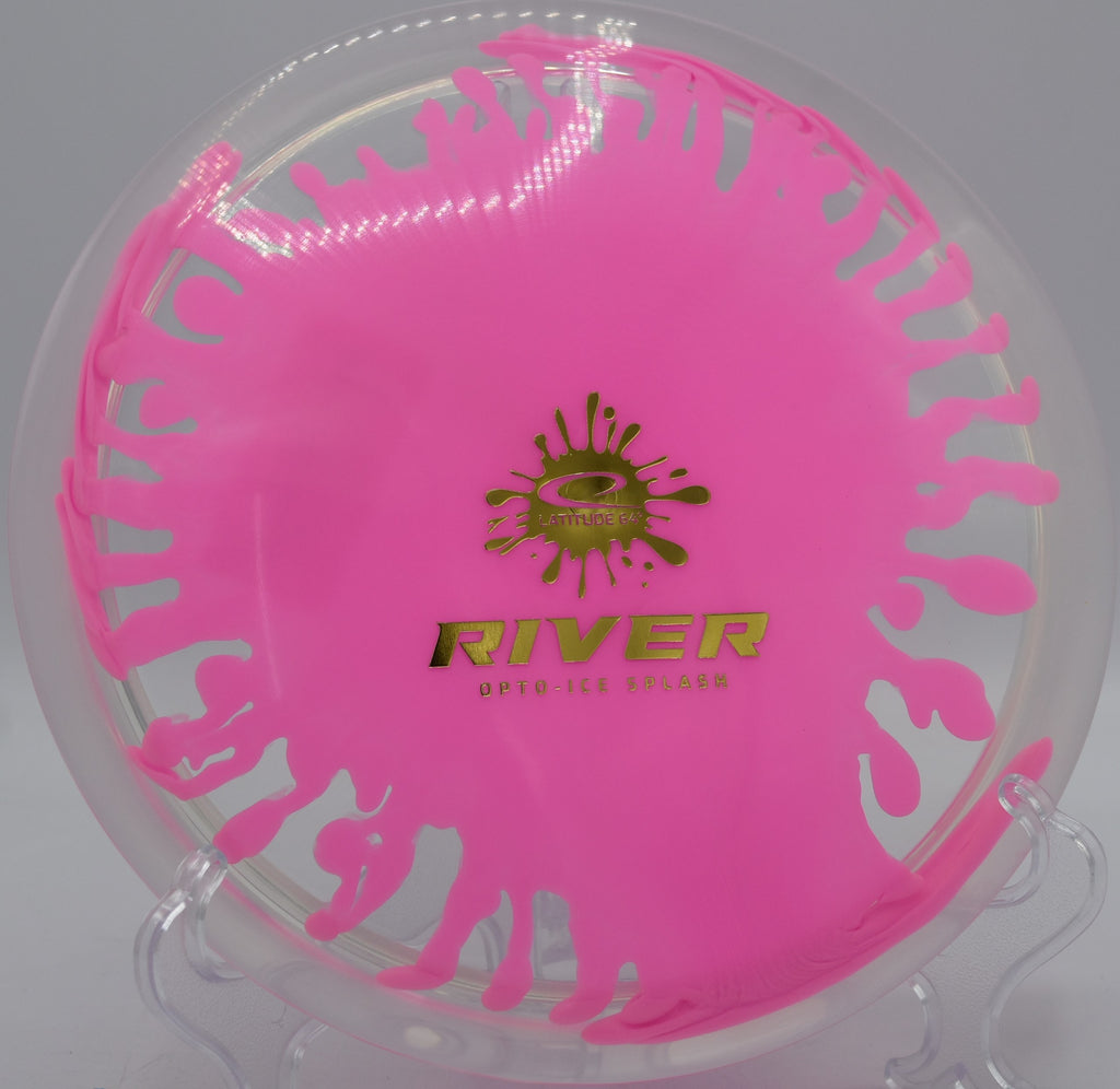 Opto-Ice Splash River gliding through a wooded tunnel at Maple Hill Disc Golf Course in Leicester, Massachusetts, showcasing its effortless turn and premium burst plastic.

