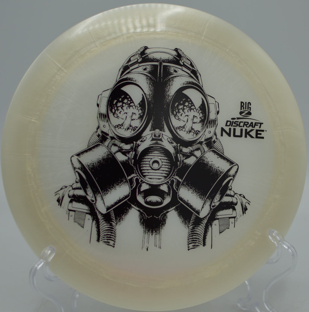 Big Z Nuke flying with power and precision over rolling terrain at Waterworks Park Disc Golf Course in Kansas City, Missouri.