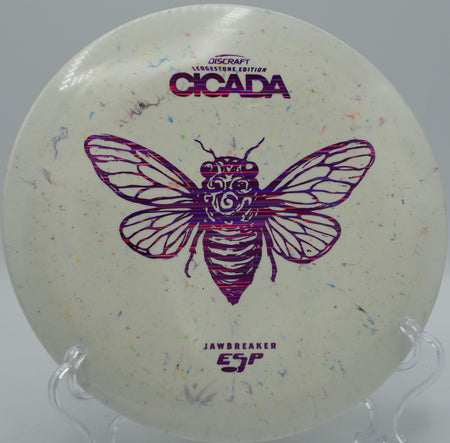 ESP Cicada in Jawbreaker swirl plastic resting under the basket at Harmon Hills in Fall Branch, Tennessee, built for finesse and consistent touch.


