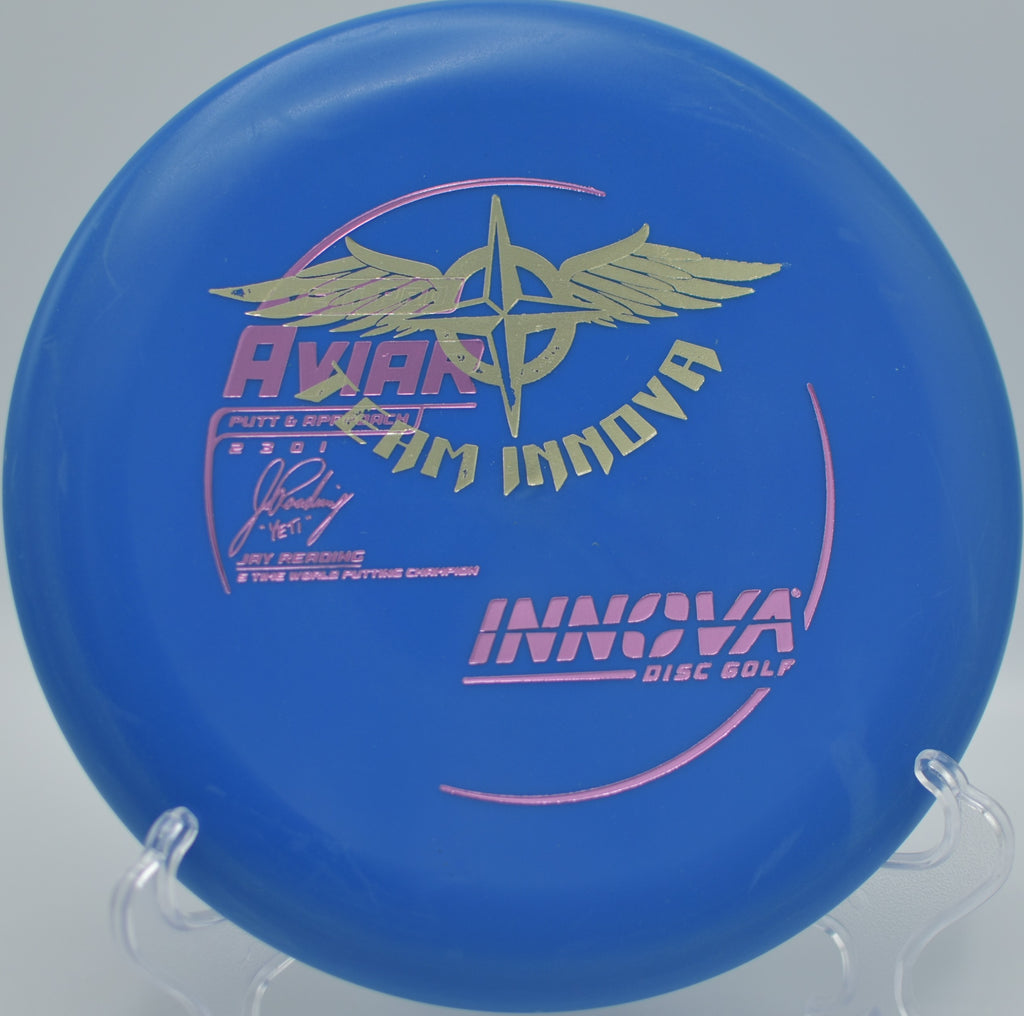 Innova Yeti Pro Aviar (Team Stamp) with gentle storage blemishes and slightly dulled stamp sheen, pictured at Blue Ribbon Pines Disc Golf Course in East Bethel, Minnesota.