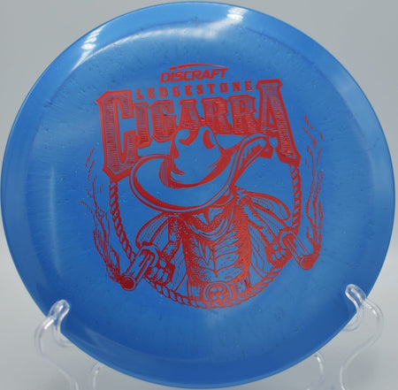 Close-up of 2026 Ledgestone Ti Sparkle Cigarra fairway driver with shimmering titanium plastic after a precise placement shot at Blue Ribbon Pines in East Bethel, Minnesota