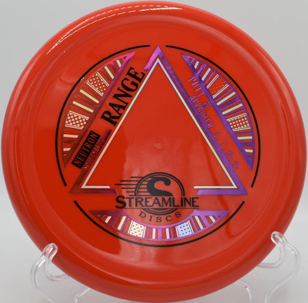 Neutron Soft Range precision approach disc lying near the basket pole after a touch forehand upshot at Riverfront Disc Golf Course in Owensboro, Kentucky