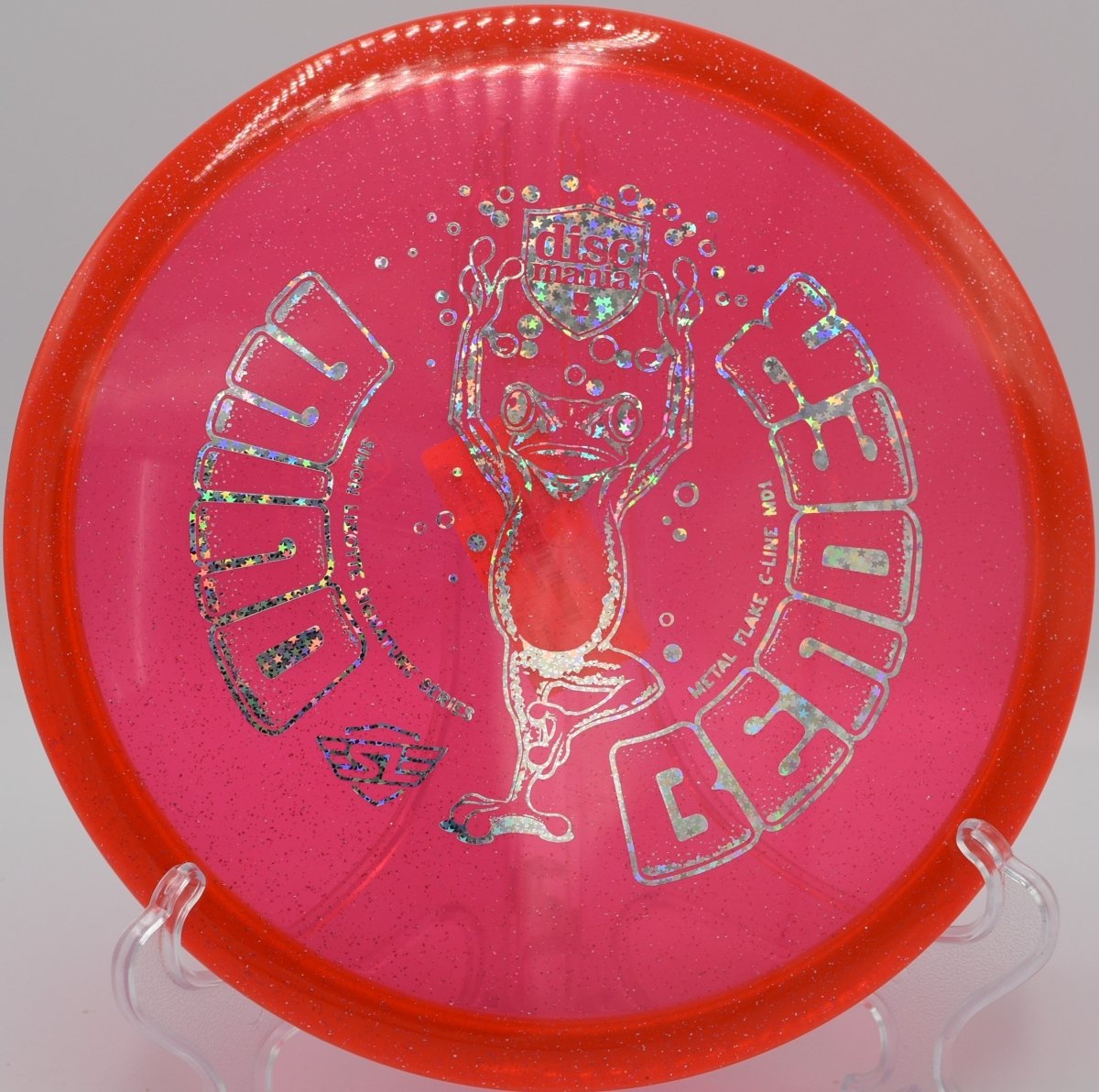 Discmania Mind Bender MD1 straight-flying disc golf midrange at Blue Ribbon Pines Disc Golf Course in East Bethel, Minnesota for smooth hyzer flips and glide.