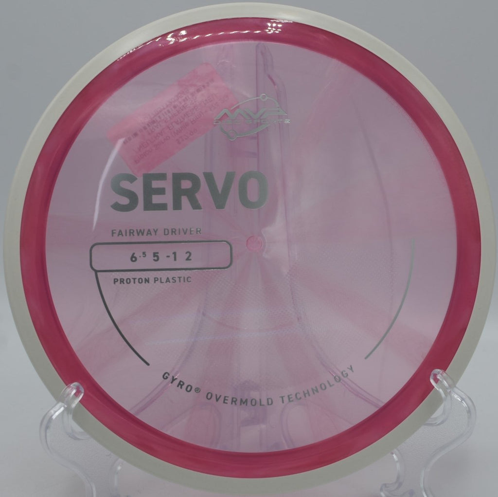 Proton Servo driven flat through wooded lanes at Lemon Lake Disc Golf Course in Crown Point, Indiana, maintaining torque resistance and smooth fade