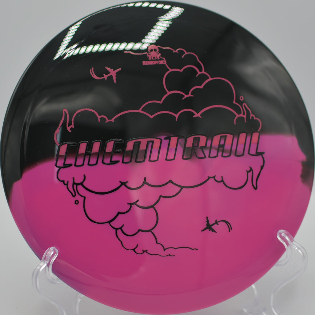 Retina Chemtrail gliding straight through a wooded gap at Blue Valley Park Disc Golf Course in Kansas City, Missouri.