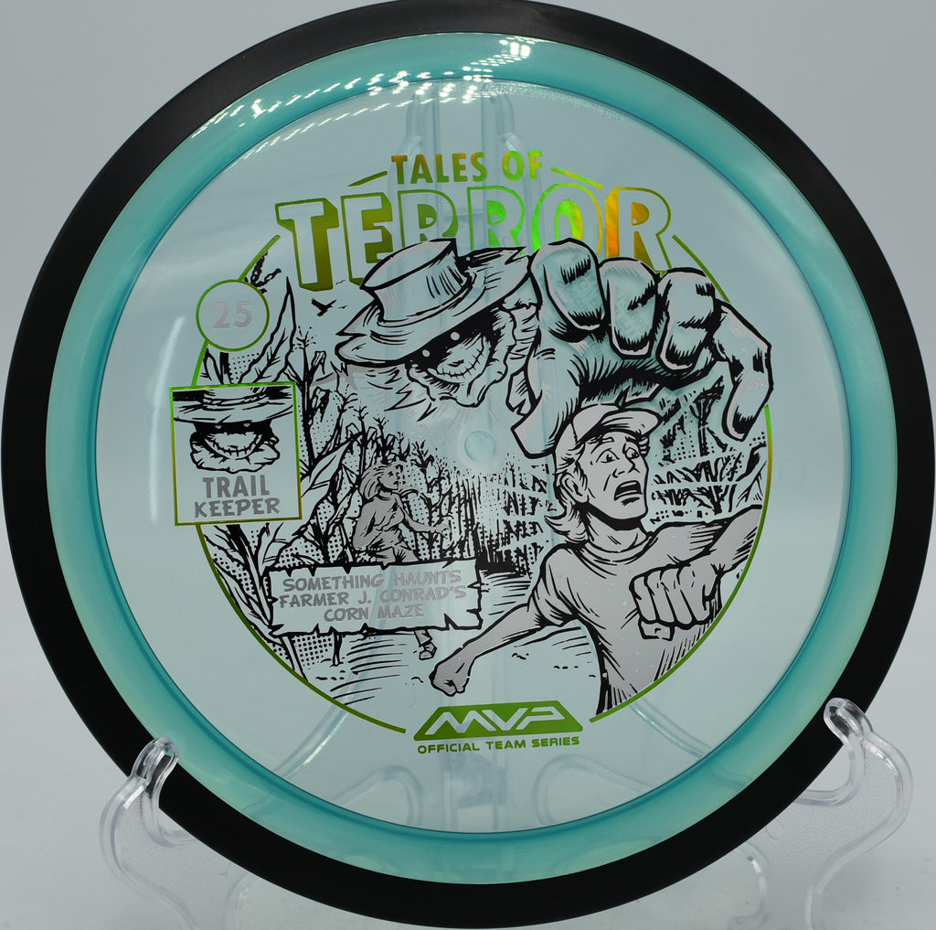 MVP Trail Proton Halloween Edition flying on a stand-up line at Birch Point Disc Golf Course in Anchorage, Alaska.