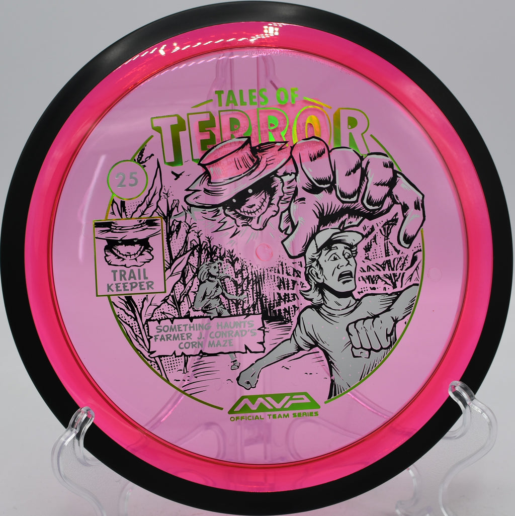 MVP Trail Proton disc with spooky 2025 artwork hugging an S-curve at Vira Disc Golf Course in Anchorage, Alaska