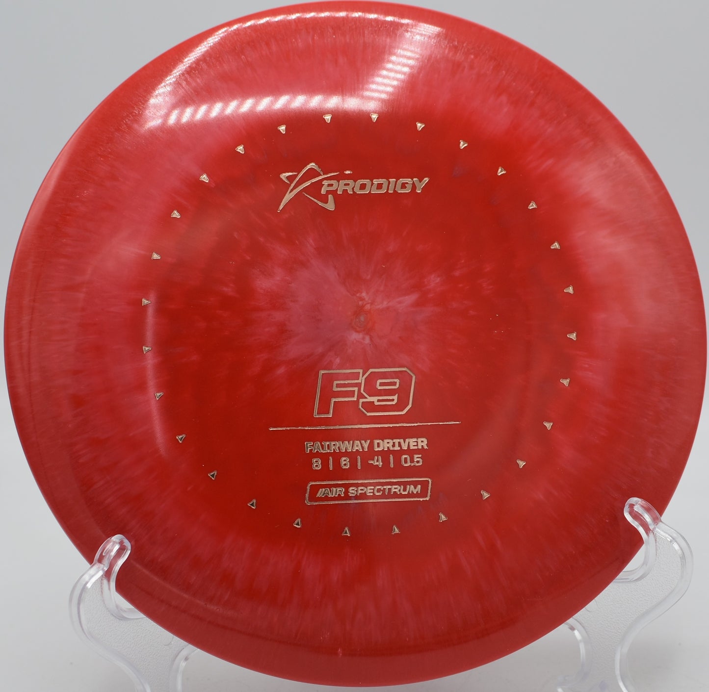 Prodigy F9 Air Spectrum mid-flight on a gentle turnover line at Harmon Hills Disc Golf Course in Fall Branch, Tennessee.