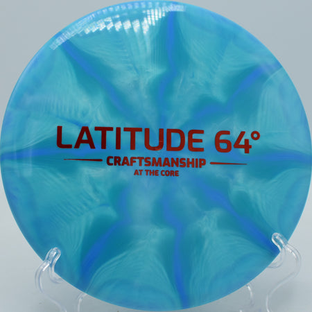 Latitude 64° Claymore Gold-Ice Burst Craftsmanship edition flying smooth hyzer flips at Hornets Nest Disc Golf Course in Charlotte, North Carolina.