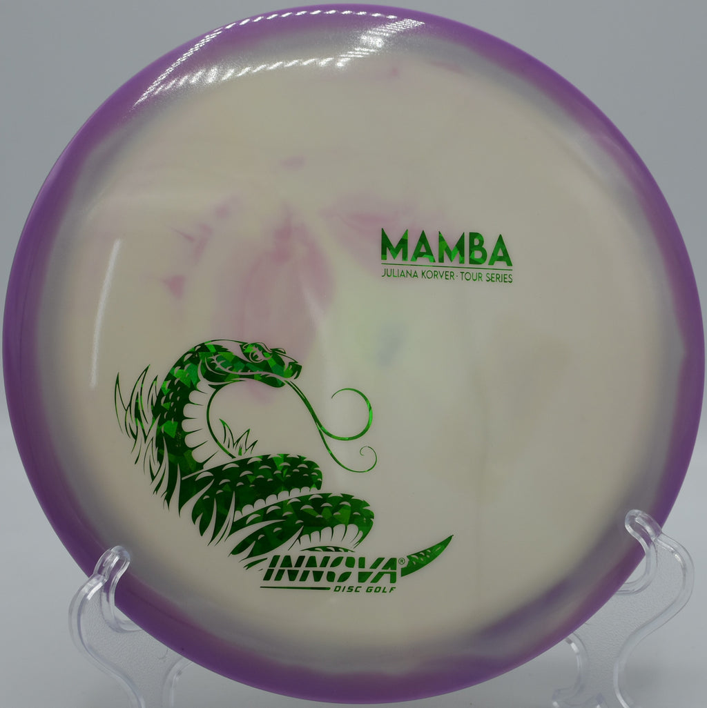 Innova Glow Mamba soaring flat and fading softly during a glow round at Maple Hill.

