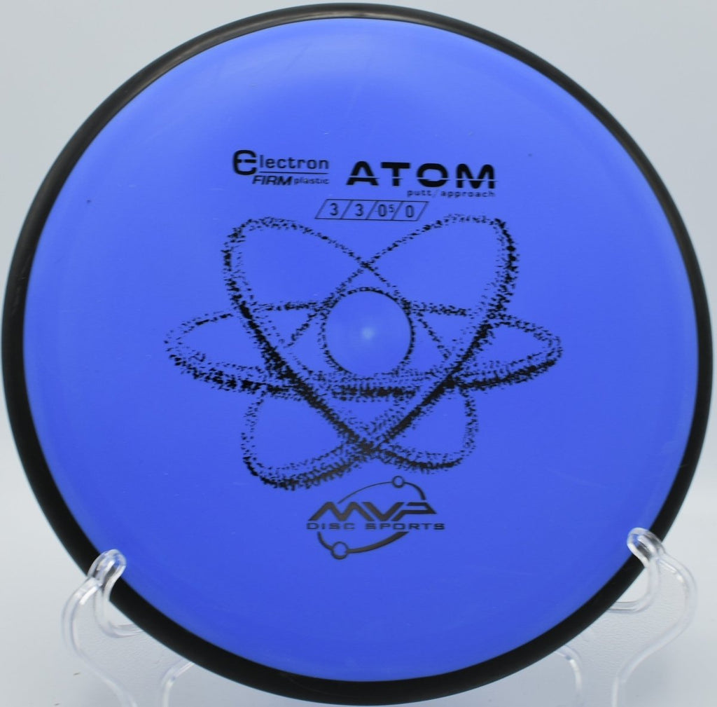 MVP Electron Firm Atom putter staged for a spin putt on the green at White River Disc Golf Course in Auburn, Washington
