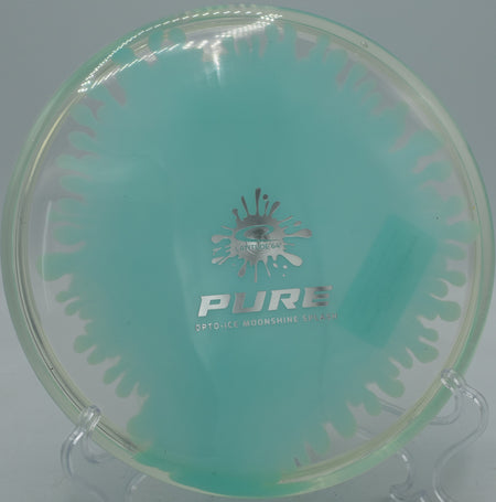 Lat64 Opto-Ice Moonshine Splash Pure parked under the basket at Brahan Springs Disc Golf Course in Huntsville, Alabama